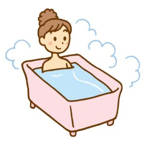 新陳代謝を上げたり自律神経の交感神経を副交感神経のバランスをとる一つに湯船に浸かると良いことがある。熱すぎない温度のお湯に浸かる女性の図